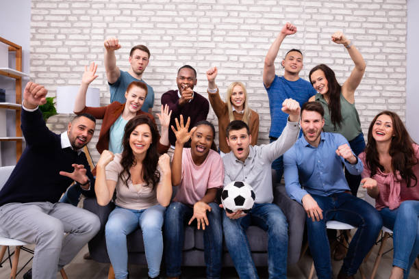 istock Friends Watching Soccer Match At Home 1157270525