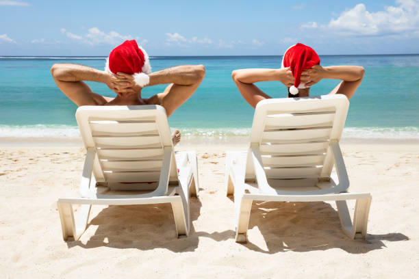 istock Young Couple Sitting On Deck Chair At Beach 1157271466