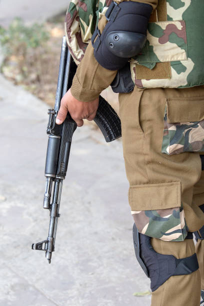 istock Warrior holding a automatic machine gun. New Delhi, India. 1157274673