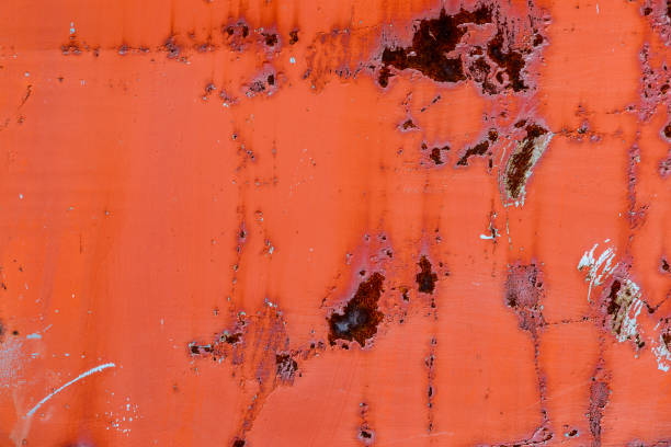 istock Old paint of red-orange color on dirty, rusty iron surface. 1157278273