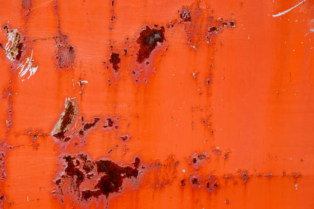 istock Old paint of red-orange color on dirty, rusty iron surface. 1157278288