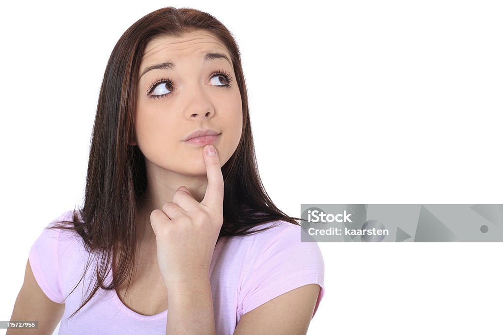 Girl deliberates a decision Attractive girl deliberates a decision. All on white background. Adolescence Stock Photo