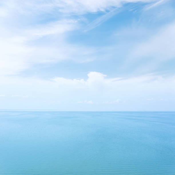 istock blue sea and white clouds in sky 1157284468