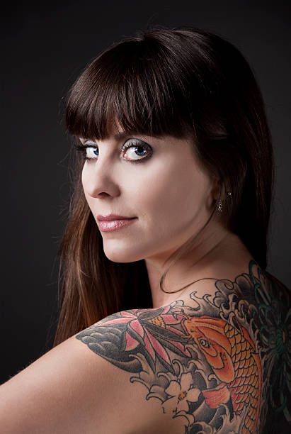 istock Woman with a tattoo 115728530