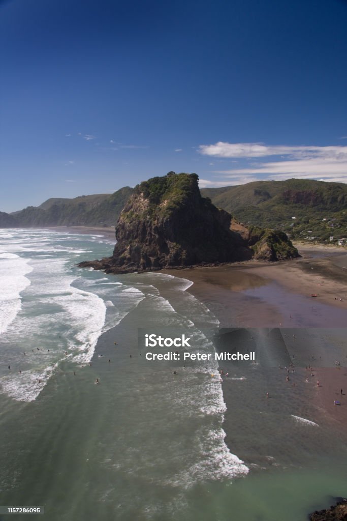 Piha Beach Piha beach is New Zealand's most visited beach. It is a black sand, surf beach 45 km west of Auckland's CDB. Auckland Stock Photo