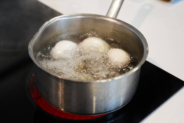 istock Preparing food on casserole pan on a electric stove, close-up. Cook egg process 1157286969