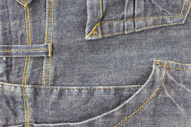 istock Side Dark Blue Jeans Pocket or Denim Pocket and Yellow Thread Background 1157288095