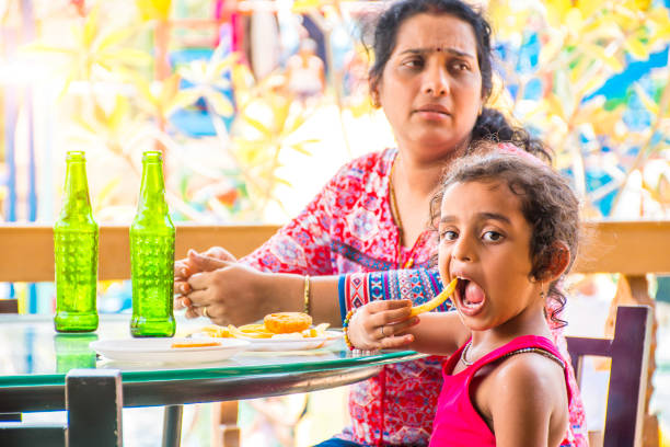 istock mother and daughter in restaurant 1157289636