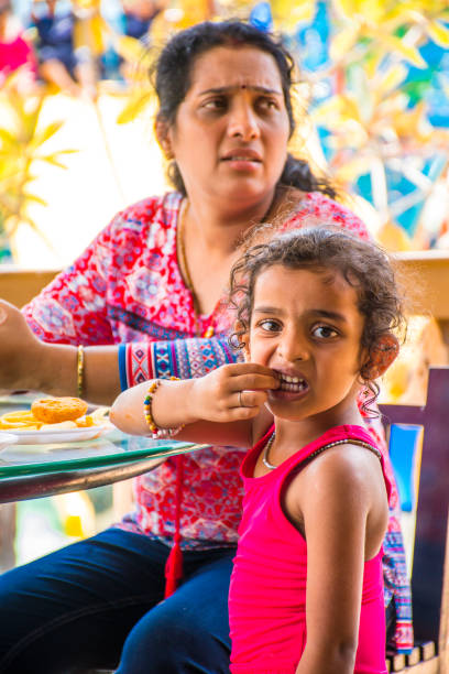 istock mother and daughter in restaurant 1157289670
