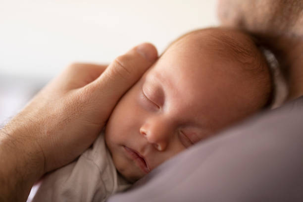 Father Putting His Baby To Sleep Stock Photo - Download Image Now - Baby -  Human Age, Father, Italy - iStock