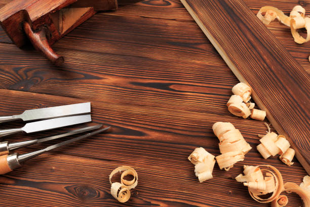 istock chisels plane and sawdust on a wooden table - Image 1157291629