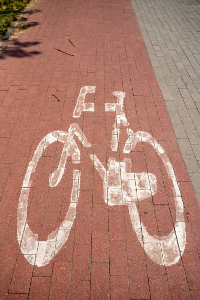 istock Bicycle path and sign denoting a place for bicycles. A place for active recreation. Season of the summer. 1157291714