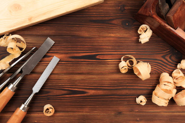 istock chisels plane and sawdust on a wooden table - Image 1157292965