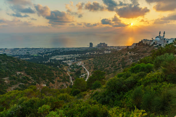 Sunset view of the Carmel coast, Siach valley and the Ahmadiyya Shaykh Mahmud mosque, in Haifa, Israel