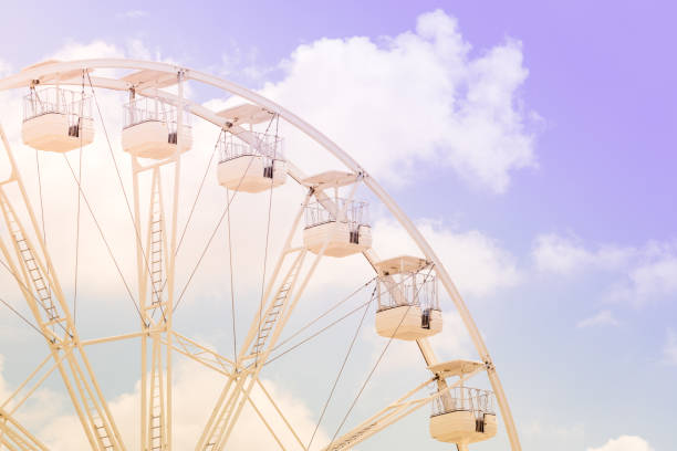 istock Ferris wheel on the colorful cloudy sky. 1157297963