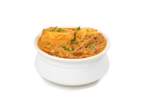 Indian spicy curry Kashmiri Dum Aloo Isolated on white background