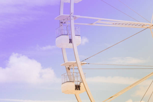 istock Ferris wheel on the colorful cloudy sky. 1157298633