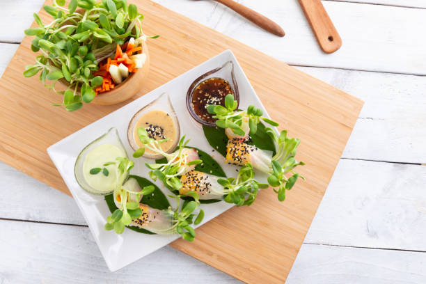 istock Rice paper salad rolls with carrot,sunflower sprout, corn and crab stick 1157298912