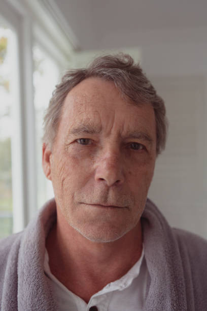 istock Active senior man looking at camera in a comfortable home 1157298952