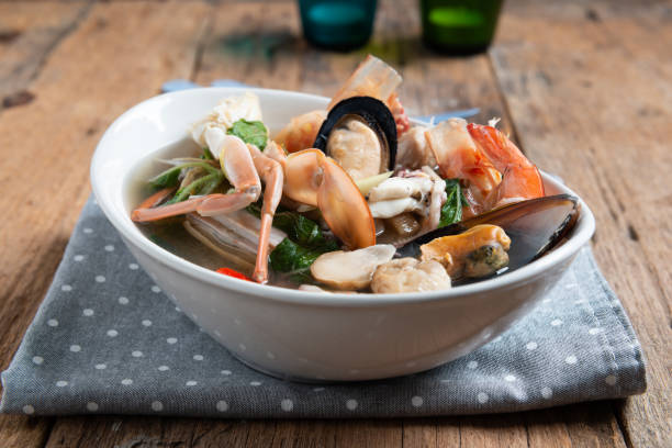 istock Spicy Seafood Soup on white dish , thai cuisine 1157299231