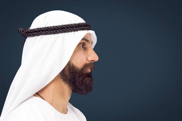 istock Arabian saudi businessman on dark blue studio background 1157303103