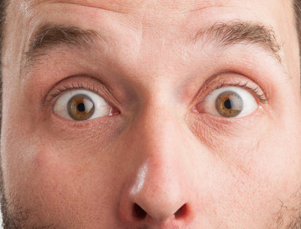 Close-Up Portrait Of Shocked Man stock photo