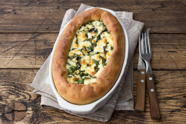 istock Open cheese pie with chard in Adjara style on the wooden table 1157306753