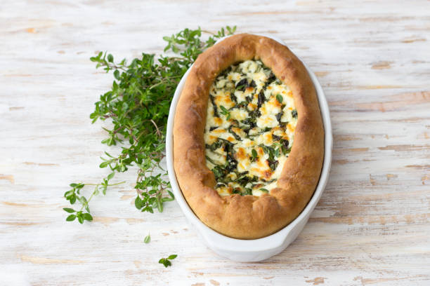 istock Open cheese chard pie with thyme  in Adjara style on the wooden table 1157306774
