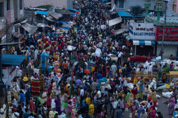 A heavily crowded Market in Bangalore Aerial view of a crowded place in Bangalore called KR market population explosion stock pictures, royalty-free photos & images