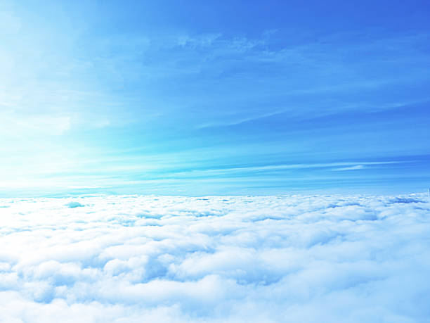 istock above the light blue sky clouds with sunlight on summer time for conceptual design idea for traveling 1157310237