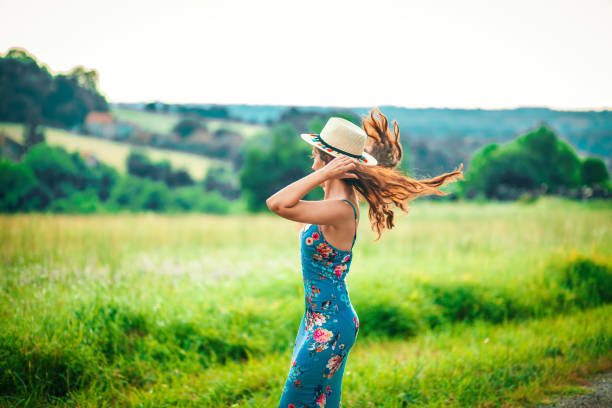 istock Girl in park smiling 1157310986
