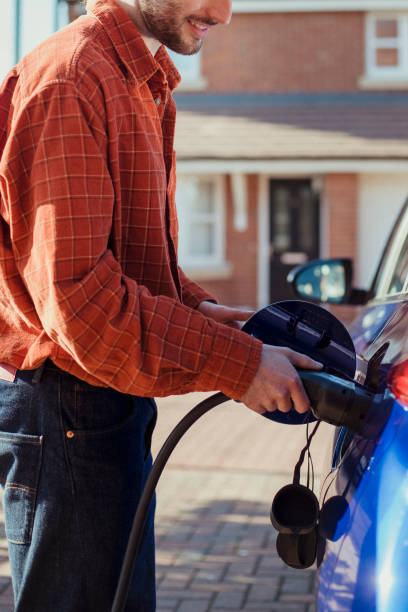 istock Re-charging Car at Home 1157312277