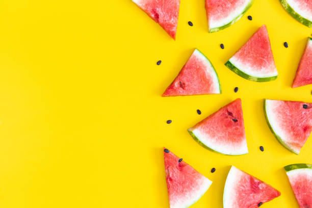 Watermelon pattern. Red watermelon on yellow background. Summer concept. Flat lay, top view