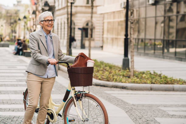 istock Woman pushing bicycle 1157315010