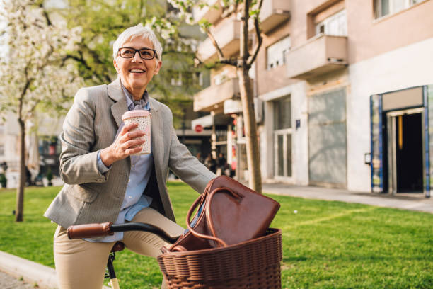 istock Woman drinking coffee on bicycle 1157315015