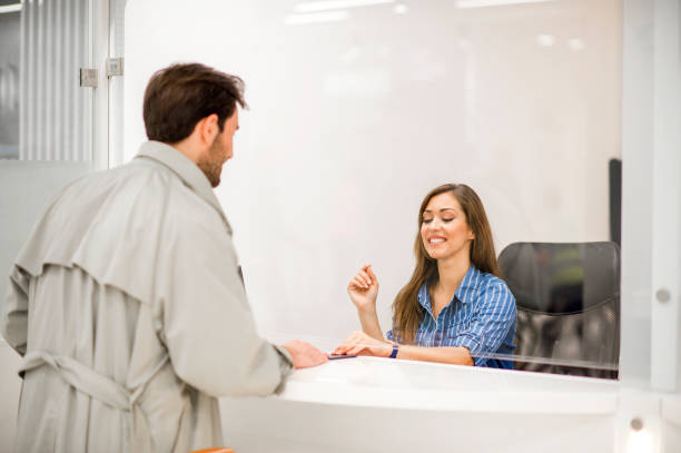 Young man buys tickets Tickets for two. Young man buys tickets box office stock pictures, royalty-free photos & images