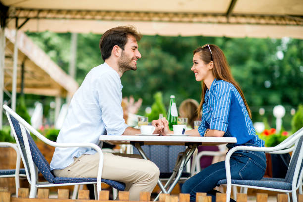 istock Couple at coffee house having coffee and chatting 1157319233
