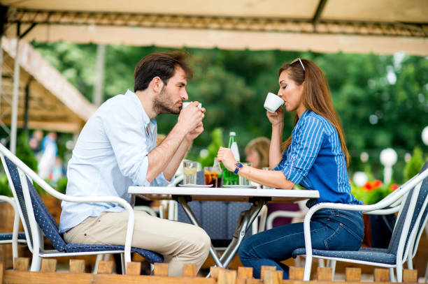 istock Couple at coffee house having coffee and chatting 1157319468