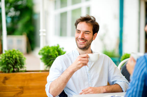 istock Young man enjoying his morning in coffee shop 1157319908