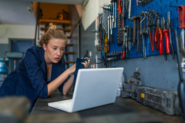 istock Female mechanic with laptop 1157320712