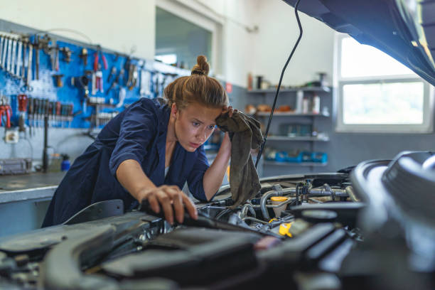 istock Mechanic repairs the engine of a car in her workshop 1157321333