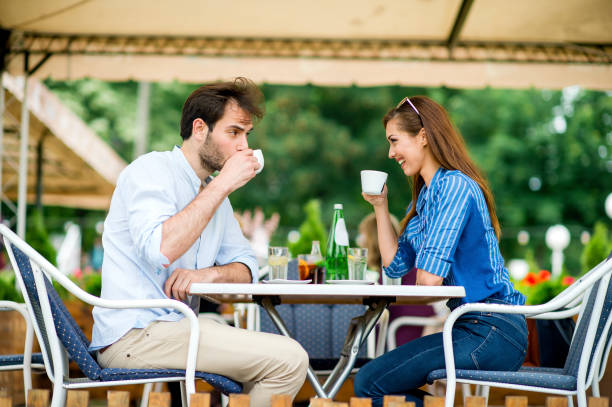 istock Couple at coffee house having coffee and chatting 1157321592