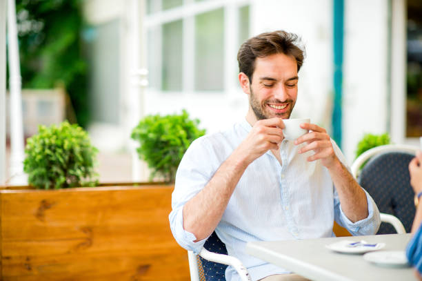 istock Young man enjoying his morning in coffee shop 1157323114