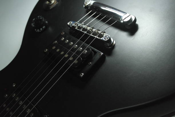 istock Close-up of black electric guitar. 1157323473