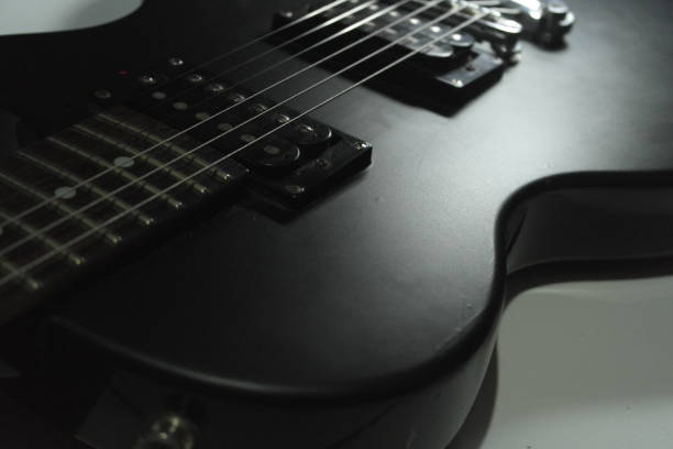 istock Close-up of black electric guitar. 1157323577