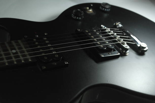 istock Close-up of black electric guitar. 1157323613
