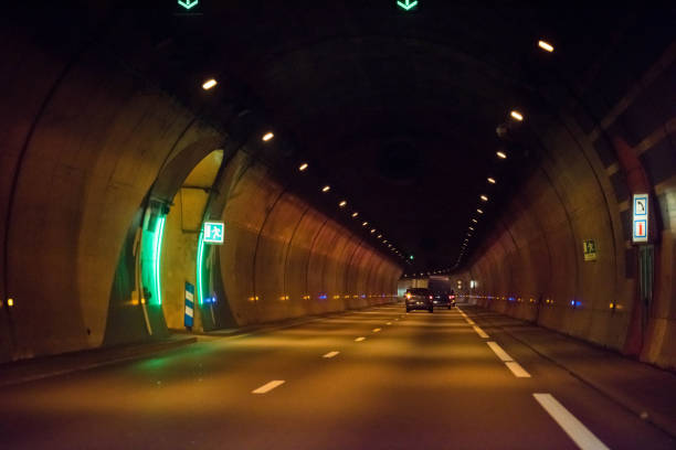istock crossing a tunnel on the highway 1157324194