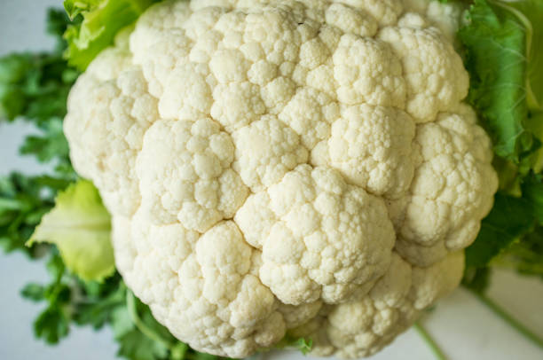 istock White cauliflower from ecological agricuture over parsley background 1157325167