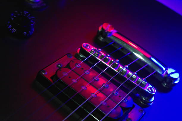 istock Close-up electric guitar body with gradient lighting effect. 1157325235