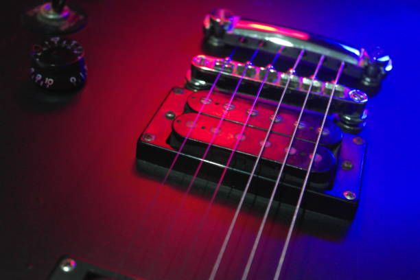 istock Close-up electric guitar body with gradient lighting effect. 1157326278